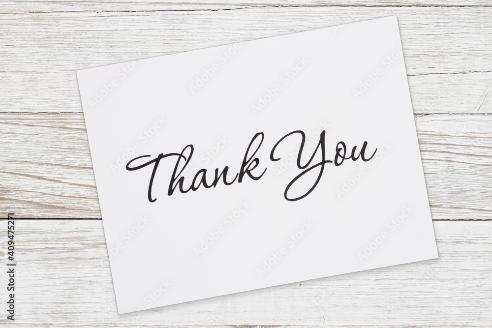 White Thank You greeting card on wood White Thank You greeting card on wood