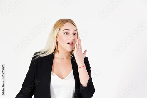 Studio portrait of blonde girl isolated on white background.