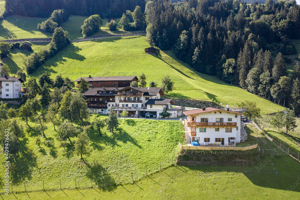Aerial drone shot of typical houses in Zillertal valley Austria summer