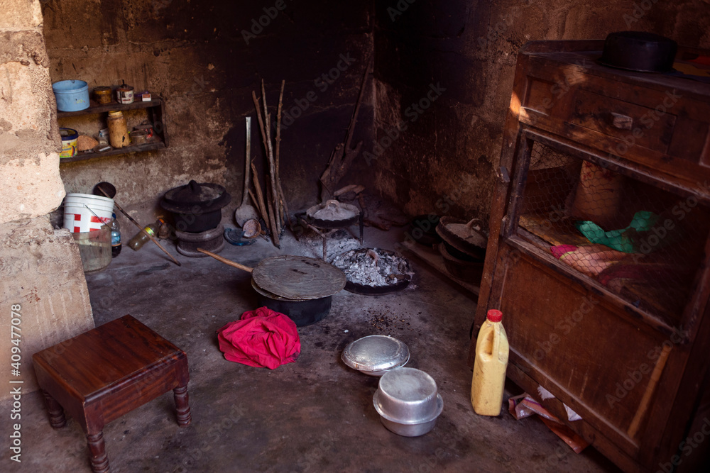 African kitchen interior with hearth and stove. Interior of the modest
