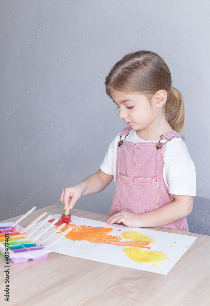 Little girl painting with ice paints. Homemade colours, Diy, activities for toddler. Little girl painting with ice paints. Homemade colours, Diy, activities for toddler.