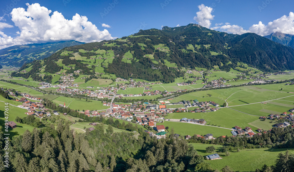 Aerial drone shot of Zillertal valley with clouds in Tyrol Austria summer