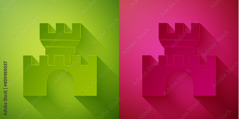 Paper cut Castle icon isolated on green and pink background. Medieval fortress with a tower. Protection from enemies. Reliability and defense of the city. Paper art style. Vector.