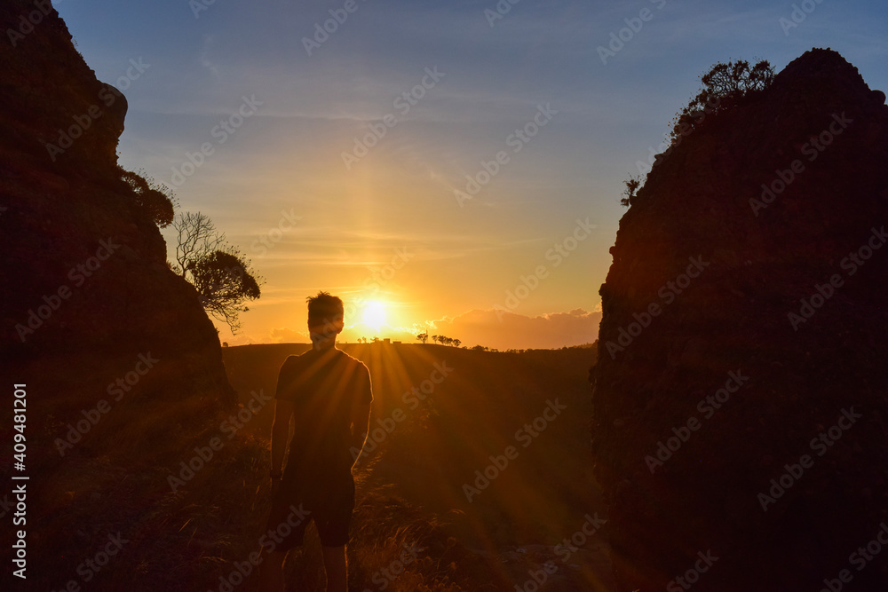 silhouette of a person at sunset