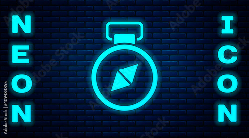 Glowing neon Compass icon isolated on brick wall background. Windrose navigation symbol. Wind rose sign. Vector.