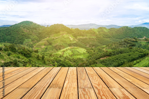 Wooden table with mountain landscape