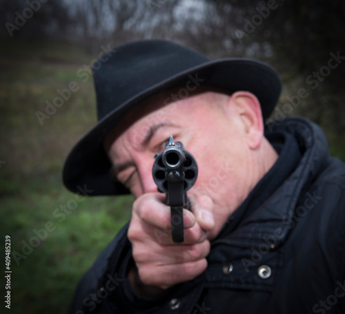 Man aiming a gun Nagan