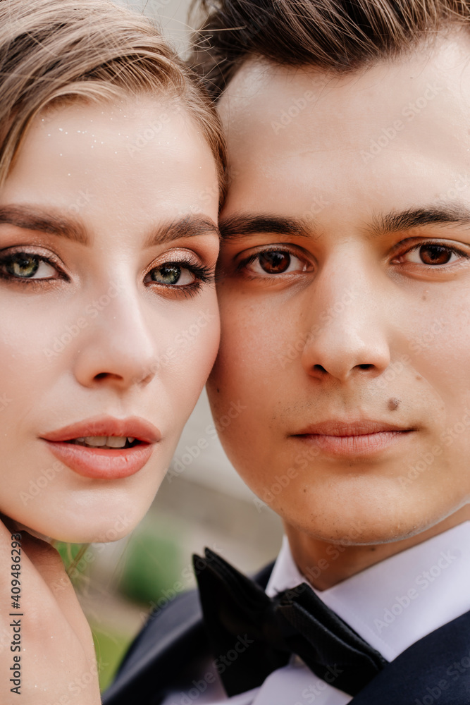 beautiful, gentle and happy bride and groom. man gently touches woman's face beautiful, gentle and happy bride and groom. man gently touches woman's face