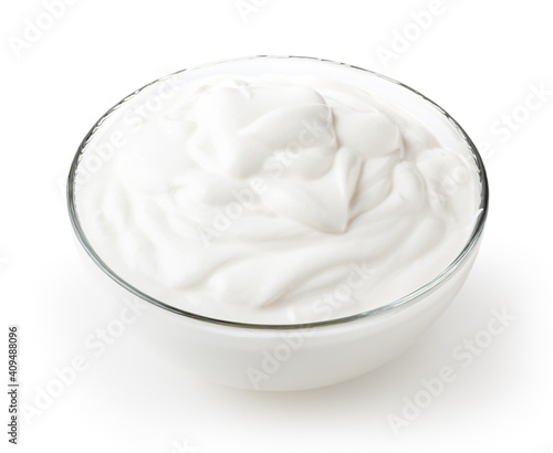 Sour cream in glass bowl isolated on white background with clipping path