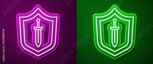 Glowing neon line Medieval shield with sword icon isolated on purple and green background. Vector.
