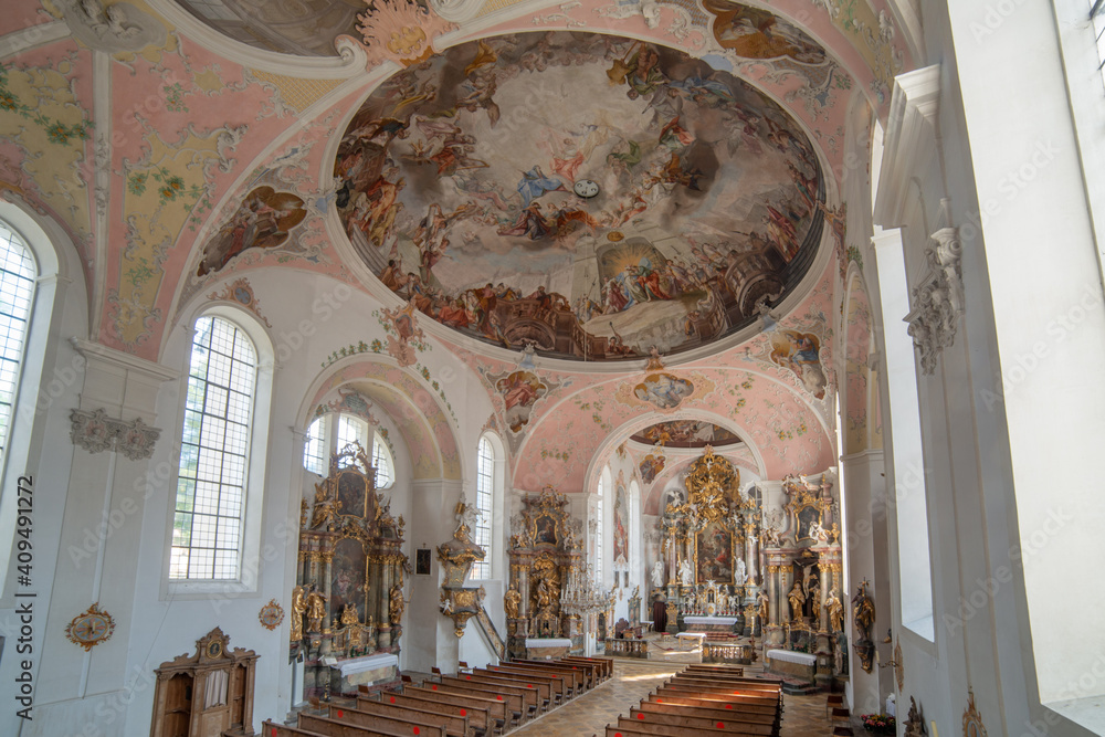 Interior architecture with furniture, decorations, frescoes and sculptures of the church of Paul Catholic Parish and St Peter in Oberammergau,