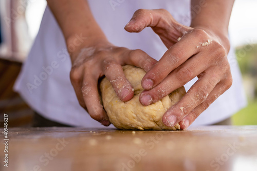 close-up of bakery production making bread with flour eggs rolling pin or rolling pin oil on wooden base background green field with sun in vacations cordoba argentina