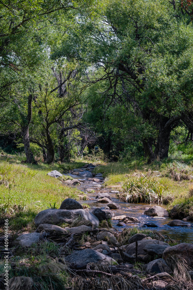 Fototapeta premium Argentine gravel and dirt routes between countryside landscapes mountains and mountains of Cordoba Argentina in the vicinity of Characato in summer