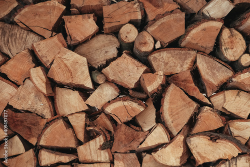 Chopped firewood as a background texture. Copy, empty space for text