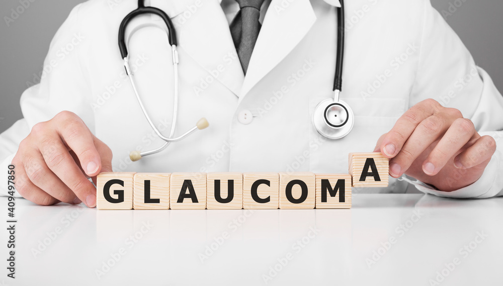 Doctor holds wooden cubes in his hands with text GLAUCOMA