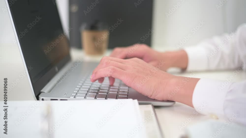 person typing keyboard using on a laptop keyboard for writer journalist or working on computer at home. Businessman work from home, or online learning concept person typing keyboard using on a laptop keyboard for writer journalist or working on computer at home. Businessman work from home, or online learning concept