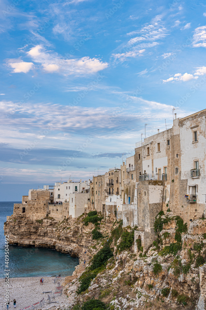 The beach of Polignano a Mare with its steep cliffs of the old town