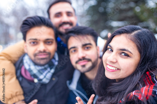 Canvas Print arabic guys having great time on Christmas holidays taking selfie photo on phone