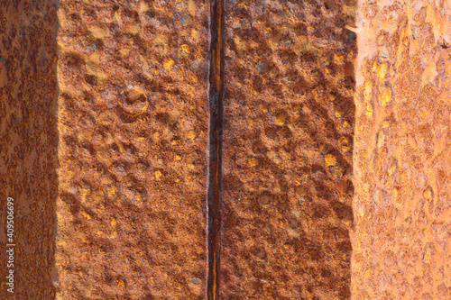 Metallic rusted plates in orange and brown