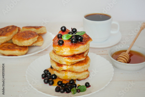 Pancakes. Stack of pancakes topped with roses jam butter. Breakfast.Pancakes. Stack of pancakes topped with roses jam butter. Breakfast.