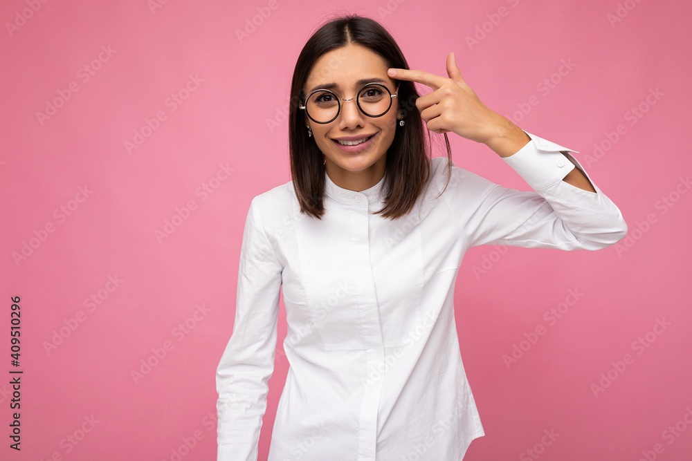 Attractive amusing funny young brunette woman wearing everyday stylish clothes and modern optical glasses isolated on colorful background wall looking at camera Attractive amusing funny young brunette woman wearing everyday stylish clothes and modern optical glasses isolated on colorful background wall looking at camera