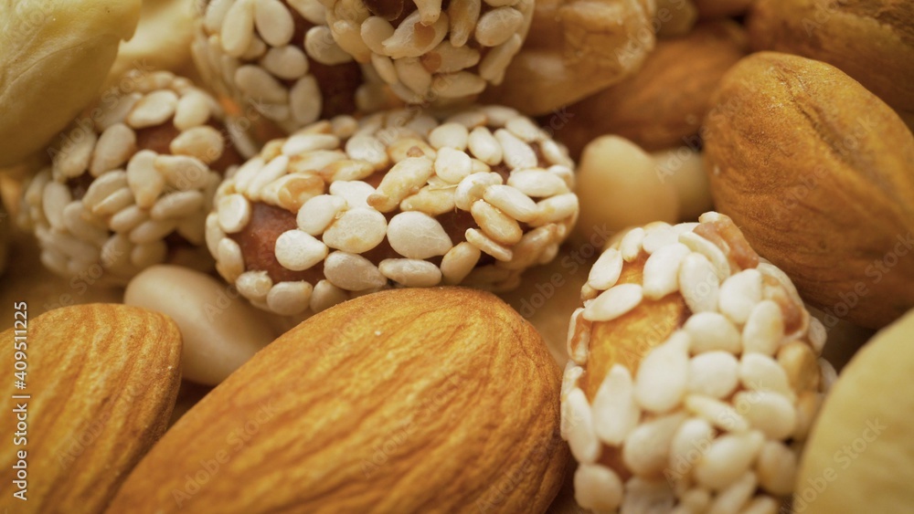Organic mixed nuts as background. Natural background made from different kinds of nuts. Nuts close up. Organic mixed nuts as background. Natural background made from different kinds of nuts. Nuts close up.