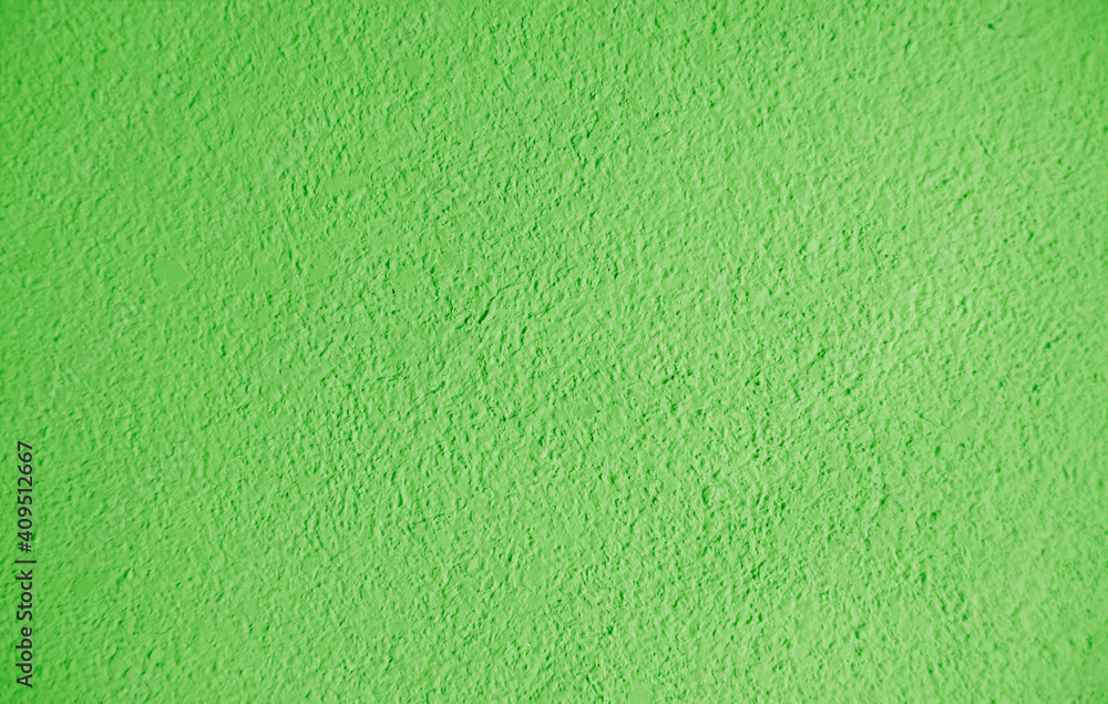 Naklejka premium Abstract grainy texture on green wall. It can be used as a design element and background