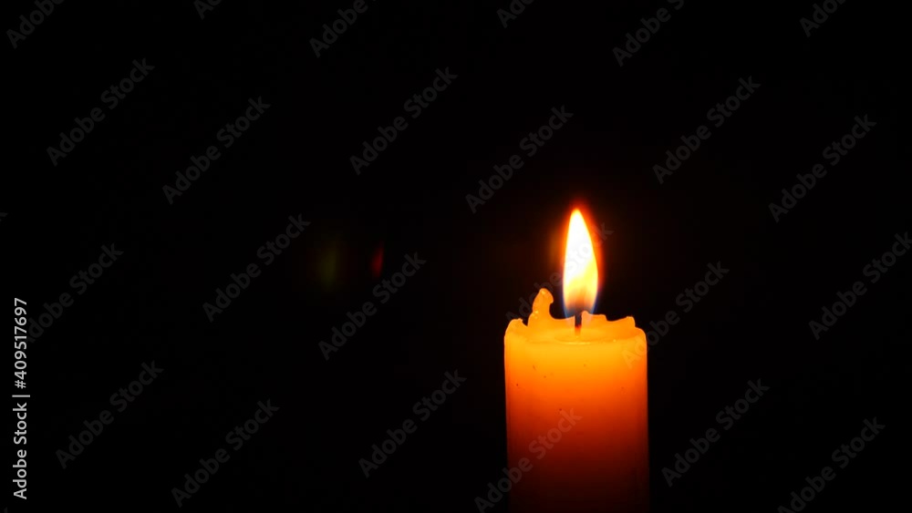 Halloween, 4k, slow-motion. A burning candle. A ghost appears behind the flame of a candle. Halloween, 4k, slow-motion. A burning candle. A ghost appears behind the flame of a candle.
