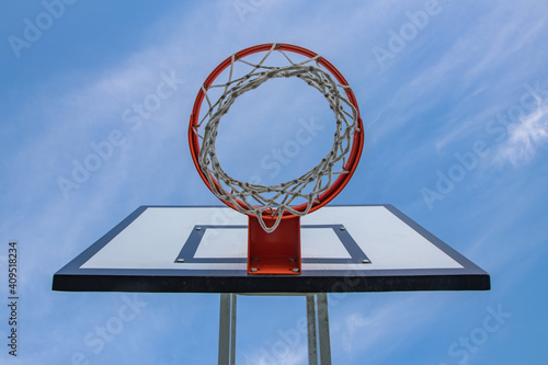 Basketball hoop on Monsanto's Natural Park, in Lisbon. With blue sky in the background.