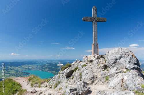 Wooden cross at top Austrain Schafberg with view at Mondsee