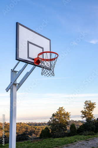 Basketball backboard on Monsanto's Natural Park, in Lisbon. With trees and blue sky in the background.