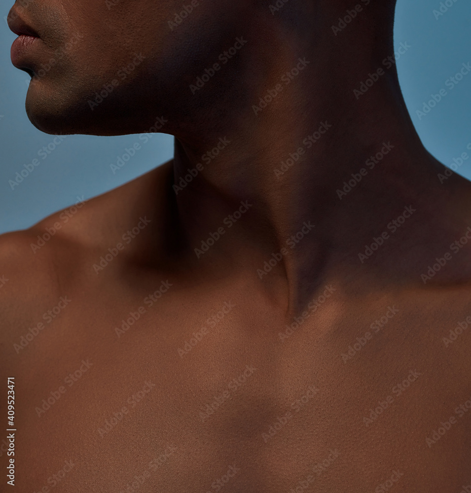Young multiracial man is posing in studio Young multiracial man is posing in studio