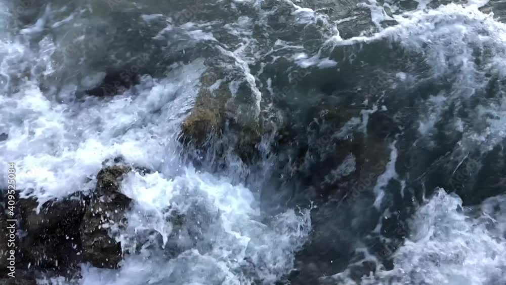 waves breaking on rocks