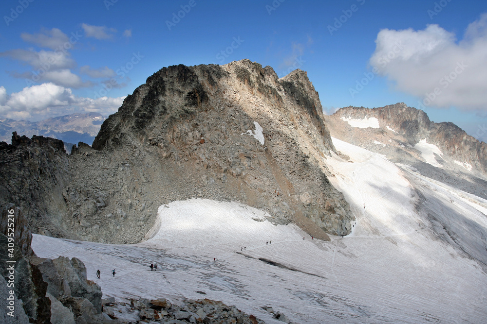 Mountaineers climbing at Mount Pico de Aneto in Huesca, Spain. Pico de Aneto is the highest mountain in Pyrenees at 3404 meters.