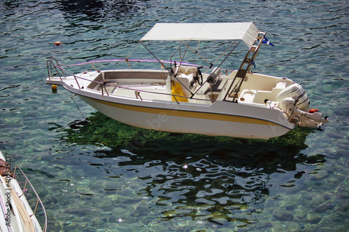 Kreta or Crete, Greece - September 10, 2017: A motor boat floating on a clean water on a mediterranean sea