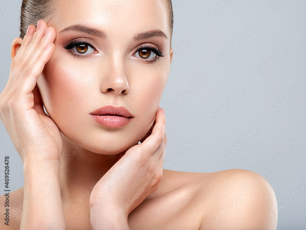 Closeup portrait of a face of the young pretty girl with a healthy skin. Beautiful face of young white woman with a clean skin. Skin care concept. Closeup portrait of a face of the young pretty girl with a healthy skin. Beautiful face of young white woman with a clean skin. Skin care concept.