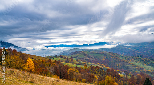 Beautiful nature of the carpathians in the hills of the sky, forests and a small village © YouraPechkin