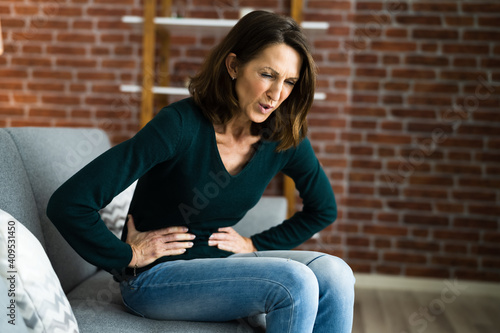 Sick Woman With Abdominal PMS Pain