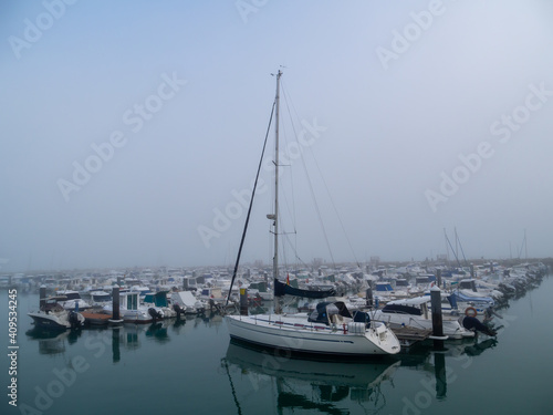 Boats in the fog in the bay of Cadiz capital, Andalusia. Spain. Europe. 