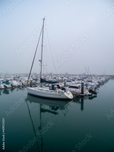 Boats in the fog in the bay of Cadiz capital, Andalusia. Spain. Europe. 