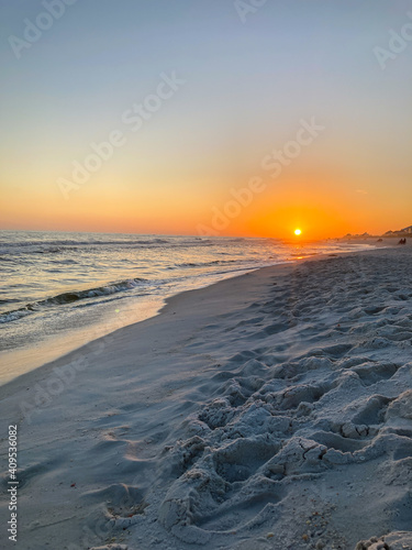 Sunset on the white sands of Navarre Beach  FL