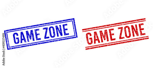 GAME ZONE rubber imprints with grunge effect. Vectors designed with double lines, in blue and red variants. Caption placed inside double rectangle frame and parallel lines.