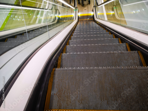 escalator in the shopping center at the exit from the underground parking