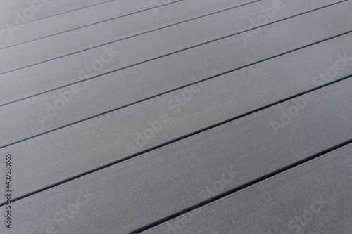 Background: modern silver gray timber piling, wood texture planks with uniform surface