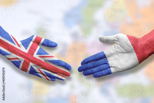 France and UK - Flag handshake symbolizing partnership and cooperation with the United Kingdom