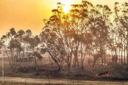 Firetrucks and Firefighters at a grassfire in Australia photo