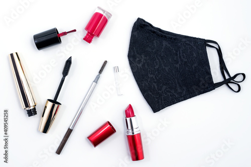 Black feminine protection mask and Makeup cosmetics such as brushes mascara, lipstick, eyeliner, nailpolish and makeup accessories isolated on white background