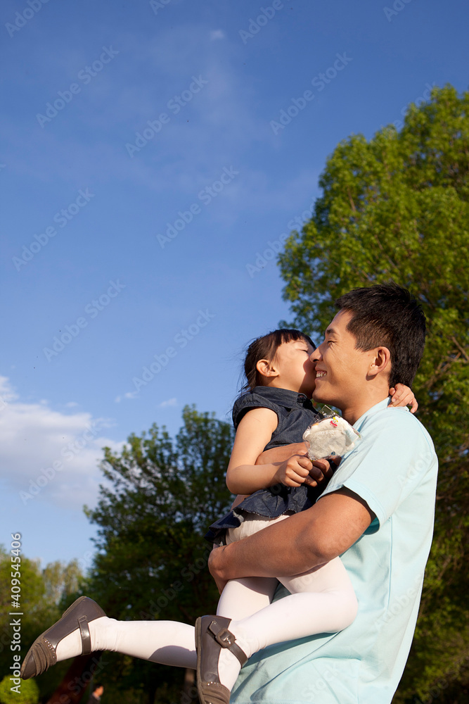 Girls kissing father's cheek Girls kissing father's cheek