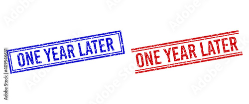 ONE YEAR LATER rubber imitations with distress effect. Vectors designed with double lines, in blue and red versions. Caption placed inside double rectangle frame and parallel lines.
