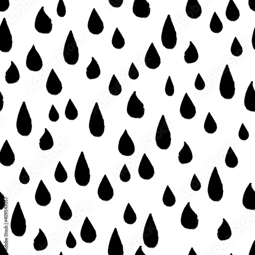 Seamless repeat pattern with all over black rain tear drops on a white background